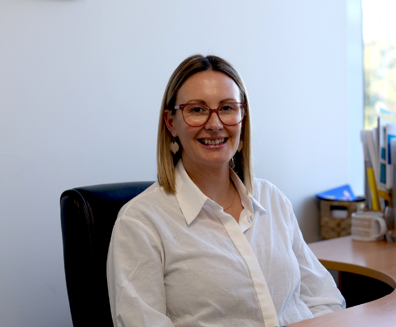School secretary smiling