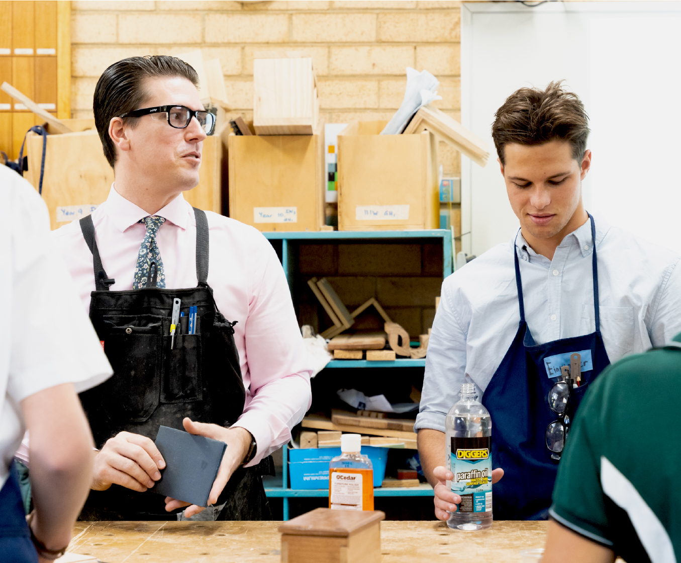 Student and teacher woodworking