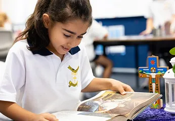 Girl reading religious text